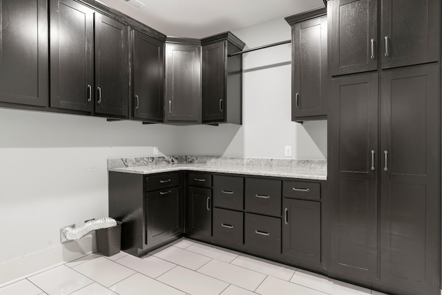 3945 Hartsville Rd, Lafayette, TN 37083 - kitchen with light tile patterned floors and light stone countertops