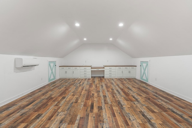 3945 Hartsville Rd, Lafayette, TN 37083 - bonus room featuring an AC wall unit, dark wood finished floors, lofted ceiling, and recessed lighting