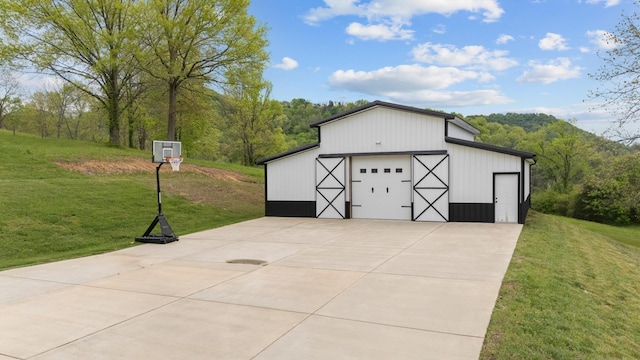 3945 Hartsville Rd, Lafayette, TN 37083 - detached garage featuring a view of trees