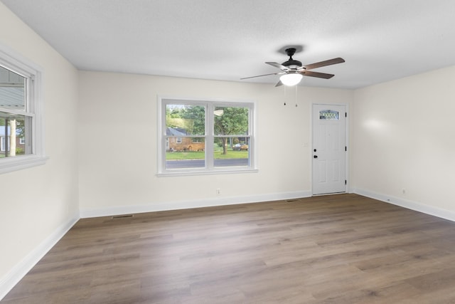 222 Jackson St, Lawrenceburg, TN 38464 - empty room featuring ceiling fan and wood finished floors