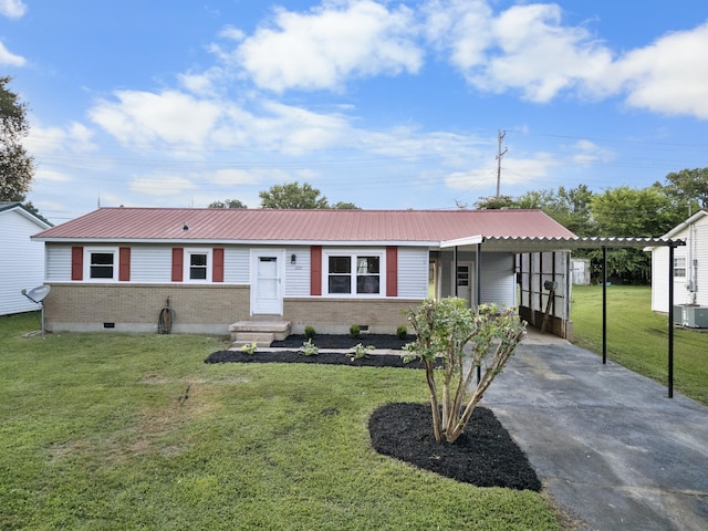 222 Jackson St, Lawrenceburg, TN 38464 - single story home featuring brick siding, concrete driveway, a front yard, a metal roof, and a carport