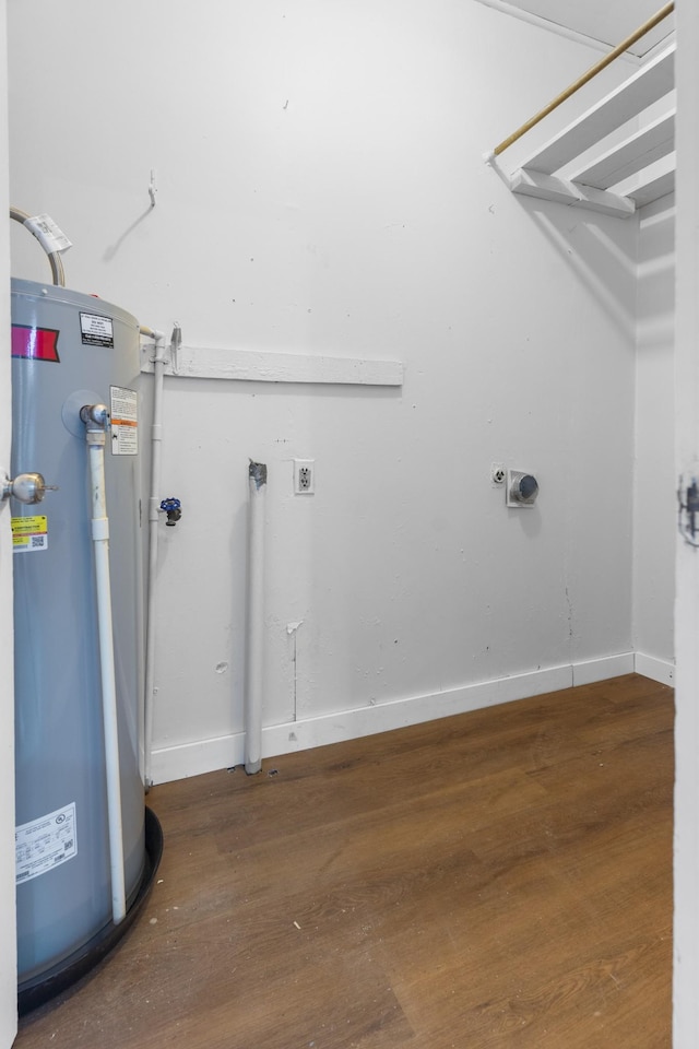 222 Jackson St, Lawrenceburg, TN 38464 - laundry room featuring water heater, electric dryer hookup, wood finished floors, and hookup for a washing machine