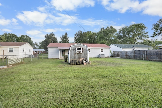 222 Jackson St, Lawrenceburg, TN 38464 - fenced backyard featuring a storage unit