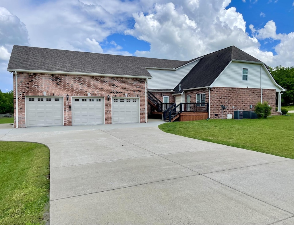 116 Nutcracker Ct, Eagleville, TN 37060 - view of front of home featuring brick siding, driveway, a front yard, an attached garage, and roof with shingles