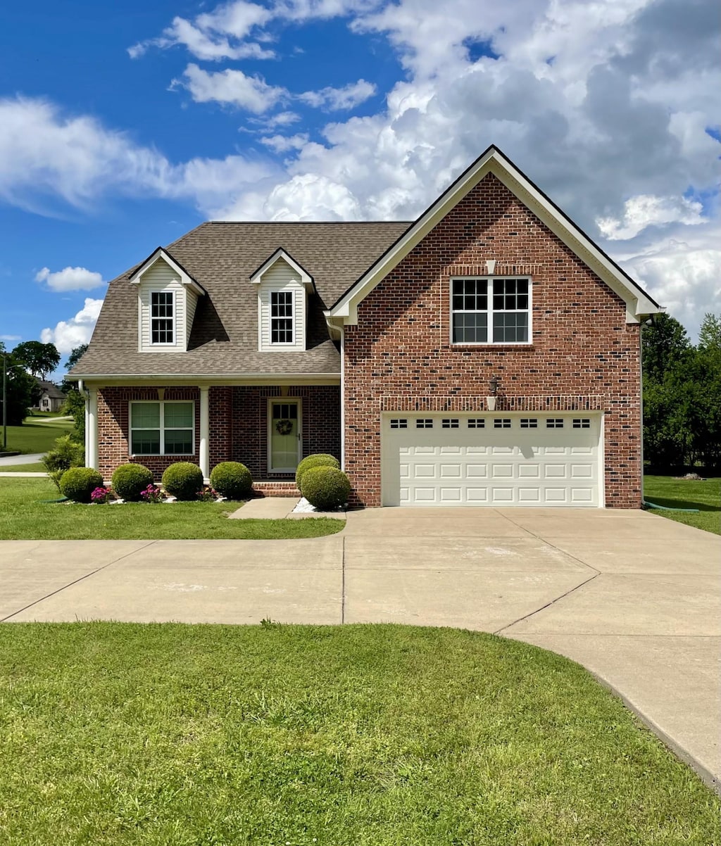 116 Nutcracker Ct, Eagleville, TN 37060 - view of front of house featuring brick siding, concrete driveway, a shingled roof, and a front yard
