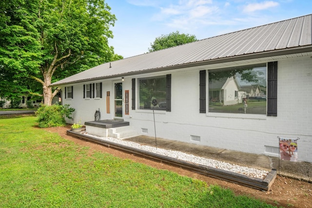 314 W 2nd St, Jasper, TN 37347 - rear view of property with crawl space, a lawn, a metal roof, and brick siding