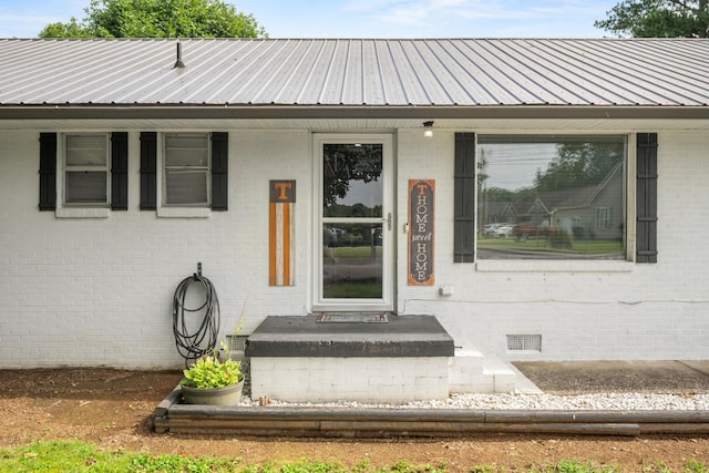 314 W 2nd St, Jasper, TN 37347 - property entrance featuring brick siding, a metal roof, and crawl space