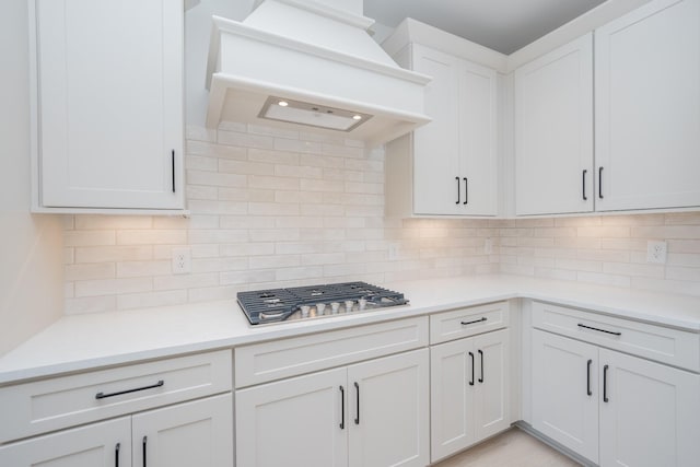 5416 Bridgemore Blvd, Murfreesboro, TN 37129 - kitchen featuring custom range hood, stainless steel gas stovetop, light countertops, and tasteful backsplash
