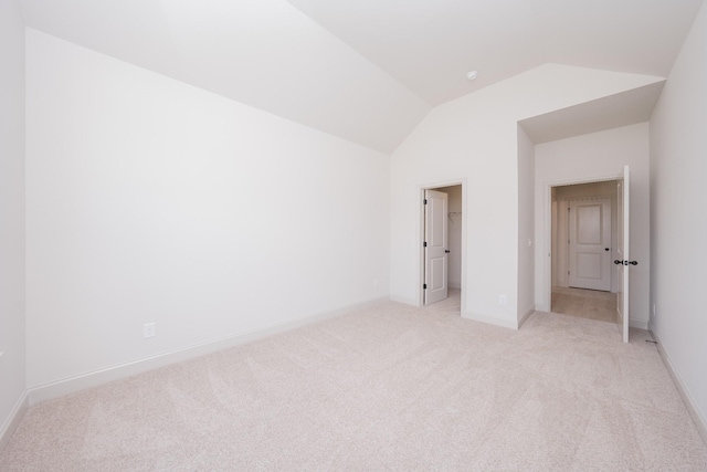 5416 Bridgemore Blvd, Murfreesboro, TN 37129 - unfurnished bedroom with vaulted ceiling, light carpet, a spacious closet, and a closet