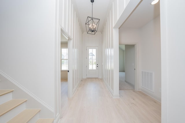 5416 Bridgemore Blvd, Murfreesboro, TN 37129 - entryway with light wood-style flooring, a chandelier, and stairs