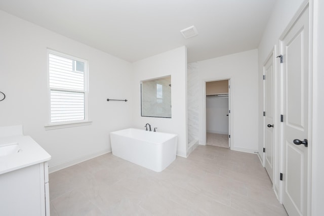 5416 Bridgemore Blvd, Murfreesboro, TN 37129 - bathroom featuring a freestanding bath, vanity, a spacious closet, and walk in shower