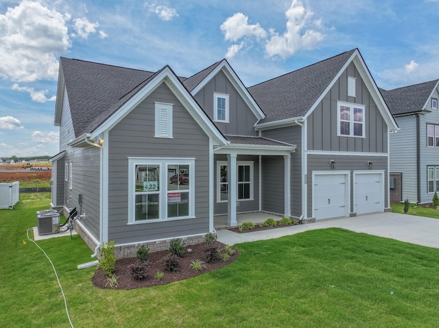 5416 Bridgemore Blvd, Murfreesboro, TN 37129 - view of front facade with board and batten siding, concrete driveway, a garage, and a front yard