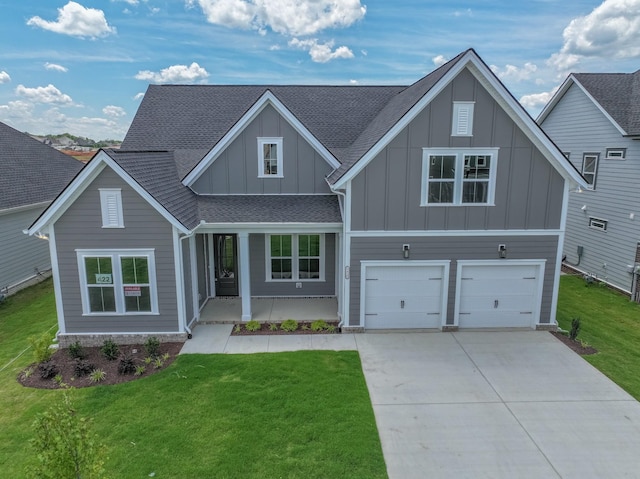 5416 Bridgemore Blvd, Murfreesboro, TN 37129 - view of front of property featuring board and batten siding, driveway, a garage, a front yard, and roof with shingles