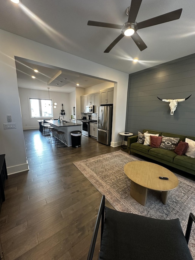 802 Vibe Pl, Nashville, TN 37216 - living area featuring dark wood-type flooring, a ceiling fan, wooden walls, and recessed lighting