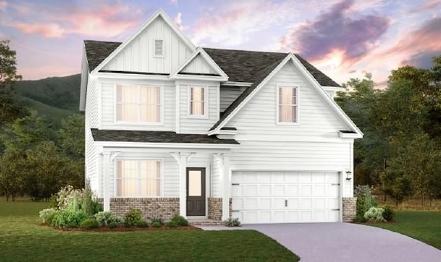 2417 Williams Ridge Dr, Columbia, TN 38401 - view of front of property with an attached garage, a lawn, board and batten siding, driveway, and brick siding