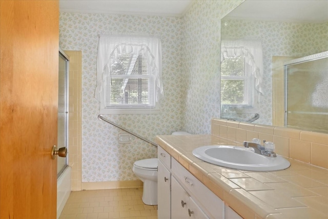 718 Midway St, Lewisburg, TN 37091 - full bath with vanity, tile patterned floors, wallpapered walls, and combined bath / shower with glass door