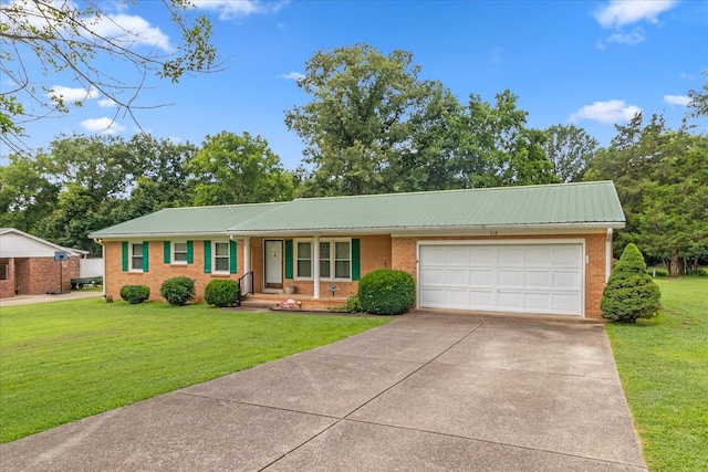 718 Midway St, Lewisburg, TN 37091 - view of front of home featuring driveway, a garage, a metal roof, brick siding, and a front lawn