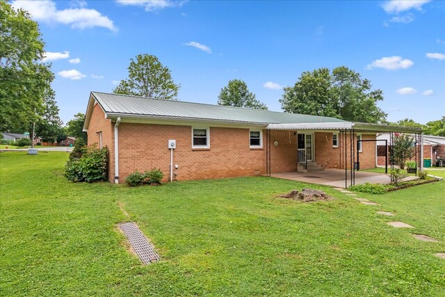 718 Midway St, Lewisburg, TN 37091 - back of house featuring a patio, brick siding, a yard, and entry steps