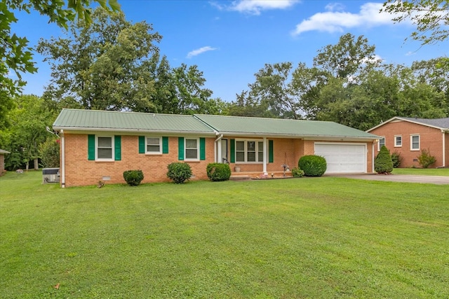 718 Midway St, Lewisburg, TN 37091 - ranch-style house with an attached garage, driveway, brick siding, and a metal roof