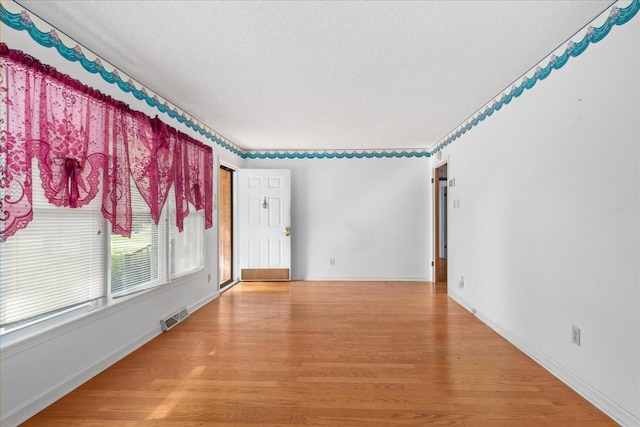 718 Midway St, Lewisburg, TN 37091 - spare room with light wood-style floors and a textured ceiling