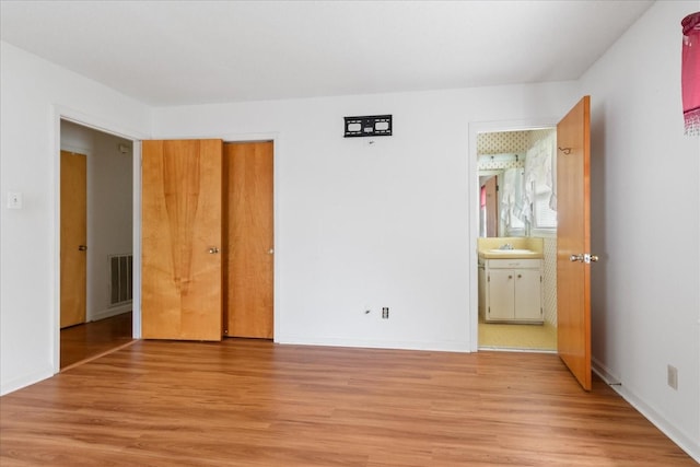 718 Midway St, Lewisburg, TN 37091 - unfurnished bedroom with light wood-style floors and connected bathroom
