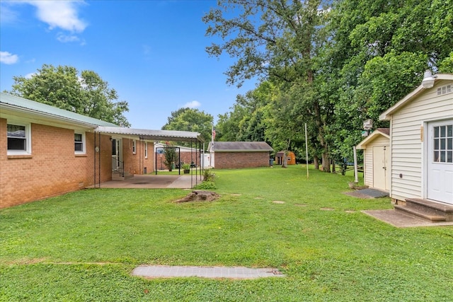 718 Midway St, Lewisburg, TN 37091 - view of green lawn with entry steps, a patio area, and a shed