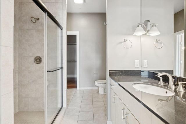 2201 8th Ave S Unit 306, Nashville, TN 37204 - bathroom with a shower stall, vanity, and tile patterned floors