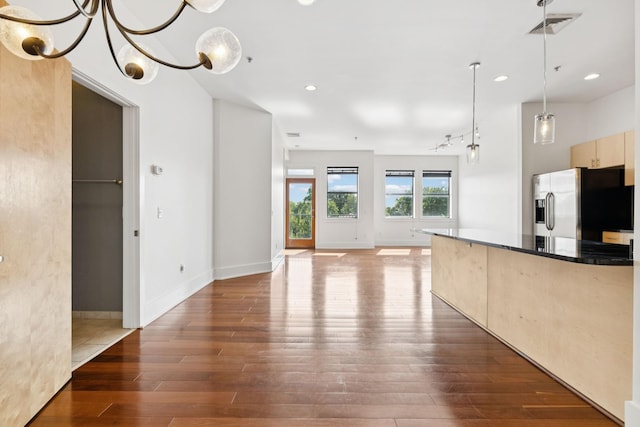 2201 8th Ave S Unit 306, Nashville, TN 37204 - kitchen with stainless steel refrigerator with ice dispenser, wood finished floors, dark countertops, recessed lighting, and light brown cabinetry