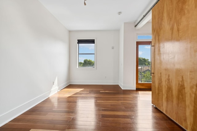 2201 8th Ave S Unit 306, Nashville, TN 37204 - empty room with dark wood-type flooring and baseboards