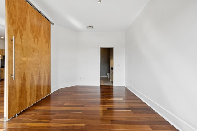 2201 8th Ave S Unit 306, Nashville, TN 37204 - unfurnished room with hardwood / wood-style floors and baseboards