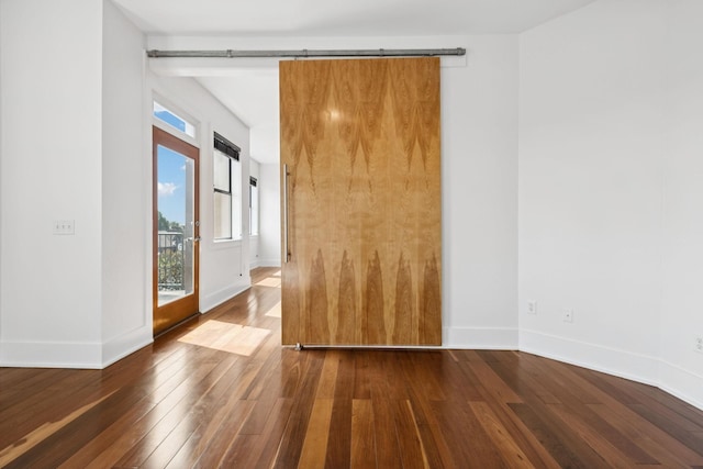 2201 8th Ave S Unit 306, Nashville, TN 37204 - unfurnished room with wood-type flooring and baseboards