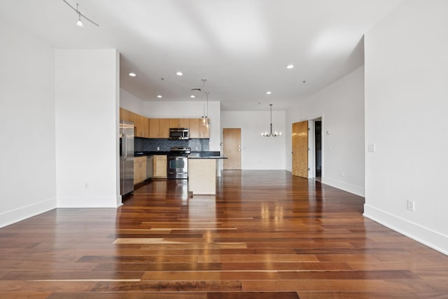2201 8th Ave S Unit 306, Nashville, TN 37204 - unfurnished living room with recessed lighting, a chandelier, and dark wood-type flooring