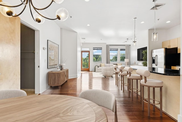 2201 8th Ave S Unit 306, Nashville, TN 37204 - bedroom featuring stainless steel fridge, dark wood-style flooring, and recessed lighting