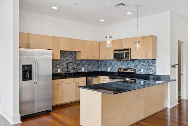 2201 8th Ave S Unit 306, Nashville, TN 37204 - kitchen featuring appliances with stainless steel finishes, light brown cabinets, a peninsula, dark wood-type flooring, and recessed lighting