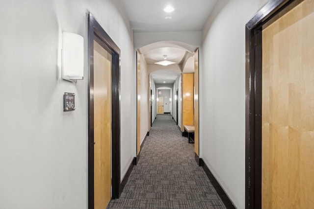 2201 8th Ave S Unit 306, Nashville, TN 37204 - hallway with arched walkways and dark carpet