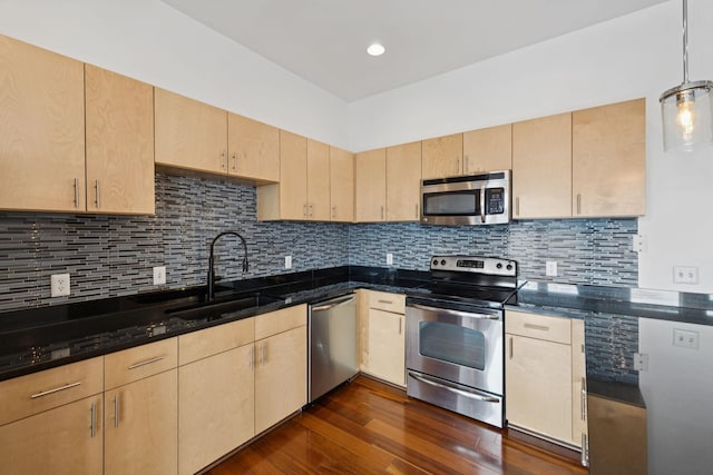 2201 8th Ave S Unit 306, Nashville, TN 37204 - kitchen featuring appliances with stainless steel finishes, light brown cabinets, dark wood-style floors, decorative backsplash, and recessed lighting