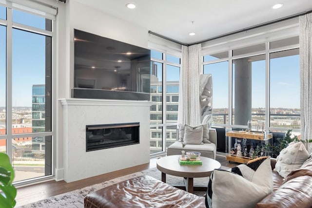 20 Rutledge St Unit 407, Nashville, TN 37210 - living room with wood finished floors, floor to ceiling windows, a premium fireplace, and recessed lighting