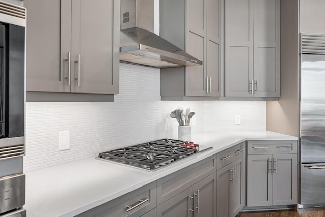 20 Rutledge St Unit 407, Nashville, TN 37210 - kitchen featuring wall chimney range hood, gray cabinets, stainless steel appliances, and light countertops