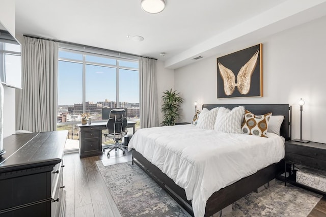 20 Rutledge St Unit 407, Nashville, TN 37210 - bedroom featuring wood finished floors, an office area, and a city view
