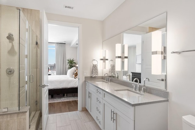 20 Rutledge St Unit 407, Nashville, TN 37210 - bathroom with double vanity, a stall shower, and ensuite bath