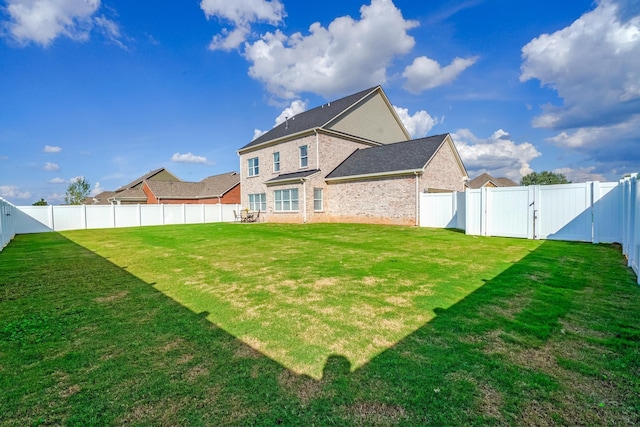 824 Promise Way, Murfreesboro, TN 37128 - back of house with brick siding, a fenced backyard, and a gate