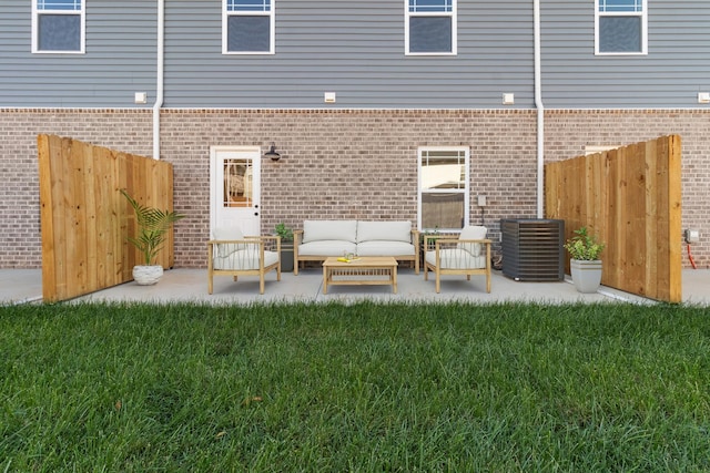 208 W Fallow Ct, Clarksville, TN 37040 - back of property featuring brick siding, a patio, and outdoor lounge area