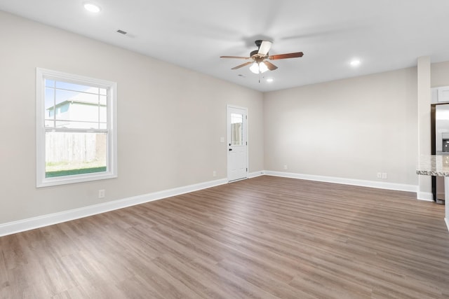 208 W Fallow Ct, Clarksville, TN 37040 - unfurnished living room featuring ceiling fan, wood finished floors, and recessed lighting