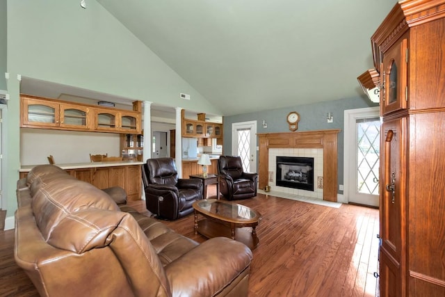 27615 Shannon Rd, Ardmore, AL 35739 - living area featuring hardwood / wood-style floors, a fireplace, and high vaulted ceiling