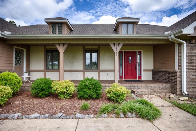 27615 Shannon Rd, Ardmore, AL 35739 - property entrance featuring a porch, brick siding, stucco siding, and a shingled roof