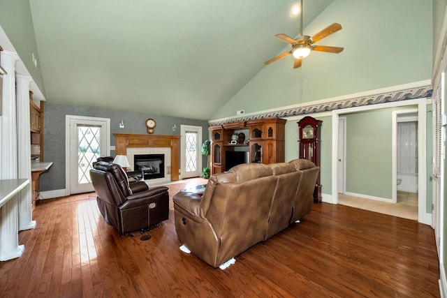 27615 Shannon Rd, Ardmore, AL 35739 - living area with high vaulted ceiling, ceiling fan, a glass covered fireplace, and wood-type flooring