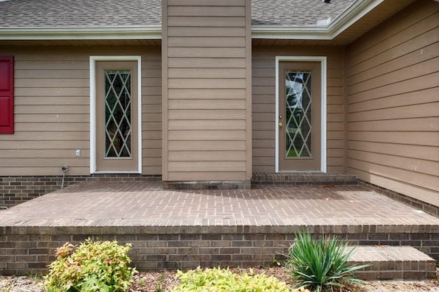27615 Shannon Rd, Ardmore, AL 35739 - view of exterior entry with a shingled roof and a patio