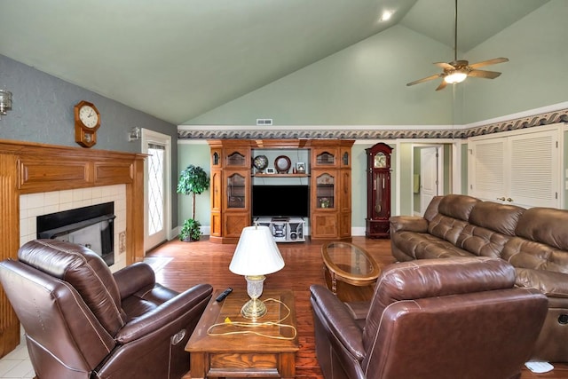 27615 Shannon Rd, Ardmore, AL 35739 - living area featuring a ceiling fan, wood finished floors, a fireplace, and high vaulted ceiling