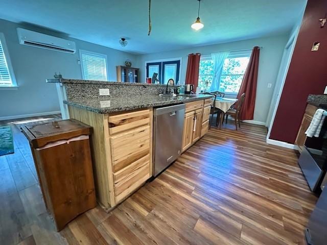 2082 Airport Ridge Rd, Linden, TN 37096 - kitchen with stainless steel dishwasher, a wall mounted AC, dark wood-style floors, and plenty of natural light