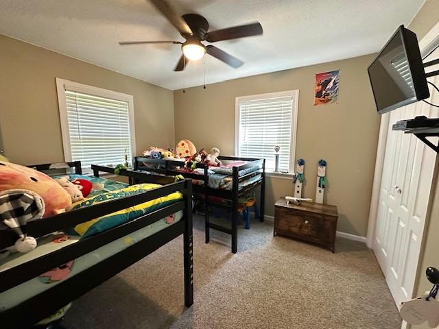 2082 Airport Ridge Rd, Linden, TN 37096 - carpeted bedroom with a ceiling fan and a closet